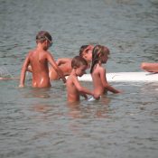 Several Kids On Surfboard